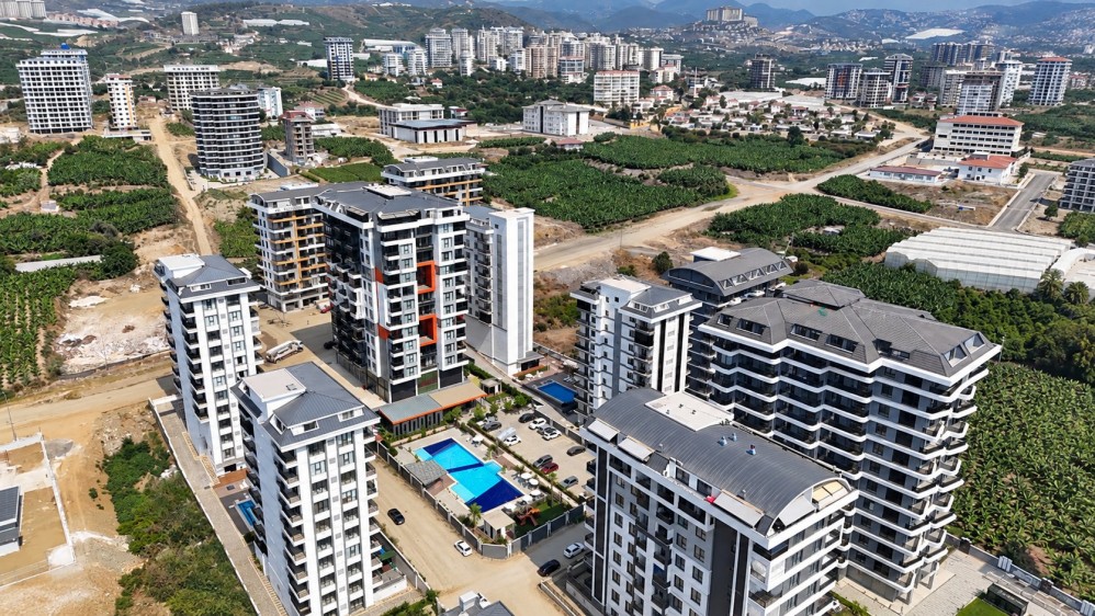 Mahmutlar – site havadan görünümTop floor 1+1, rent guarantee