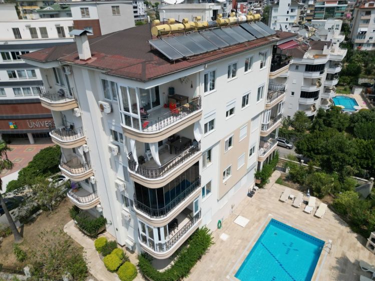 Alanya Cikcilli Satılık 2+1 Eşyalı Daire – Havuzlu, Kısmi Deniz Manzaralı, İkamete Uygun