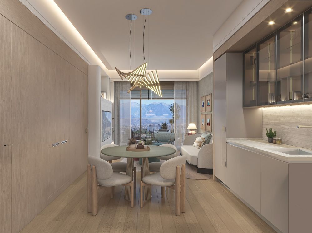 Combined kitchen and dining area with elegant modern interior design.Luxury High-Ceiling Apartments in Antalya