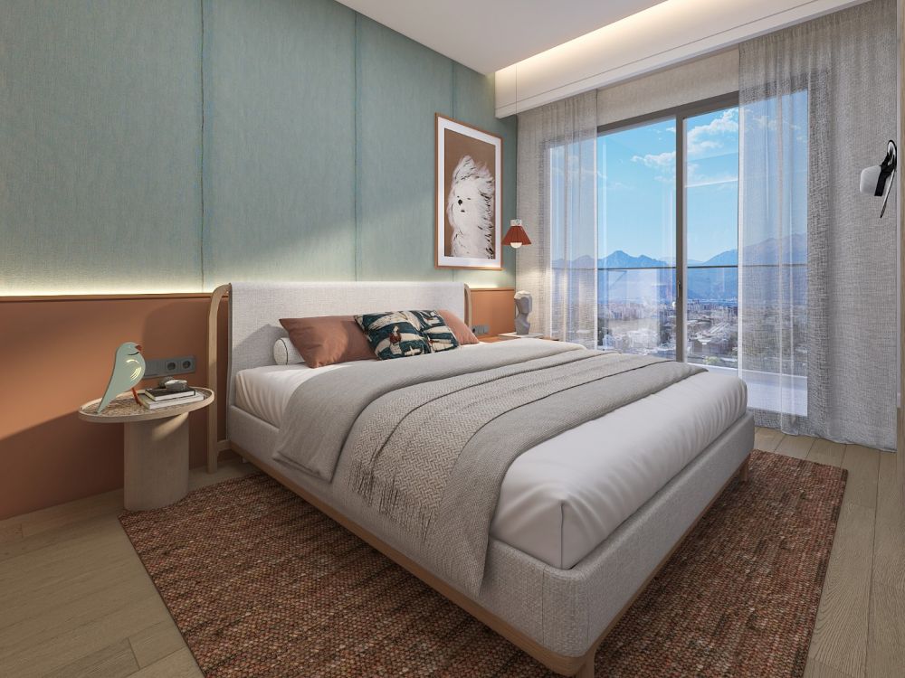 Spacious bedroom with modern furniture and bright interior design.Luxury High-Ceiling Apartments in Antalya