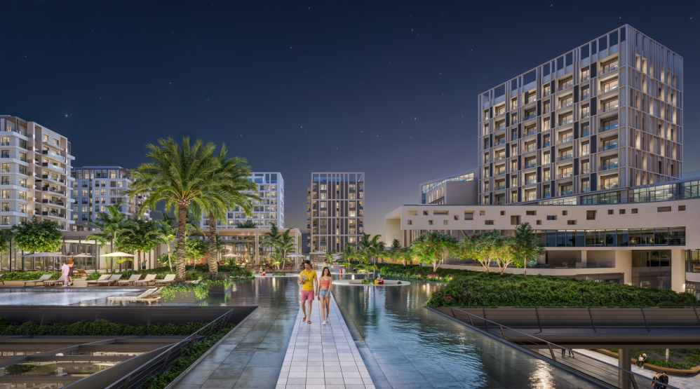 Night view of the landscaped entrance area with water features and lighting.Luxury High-Ceiling Apartments in Antalya