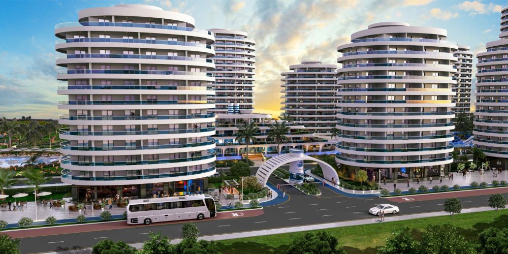 Yüksek katlı rezidans ve çevresindeki yeşil alanlardan panoramik görünüm.Kıbrıs’ta Denize 600 mt Mesafede Ultra Lüks Konut Projesi