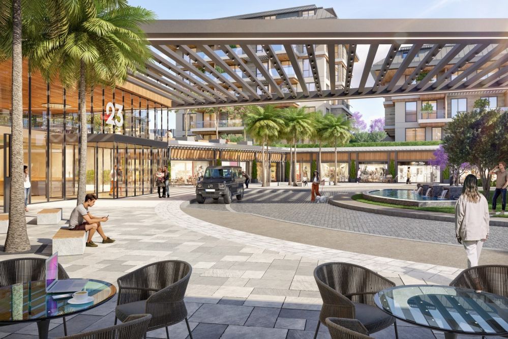 Главный вход с открытым кафе и коммерческими помещениями вдоль улицы.Элитные квартиры на продажу в районе Оба, Алания — Новый инвестиционный проект