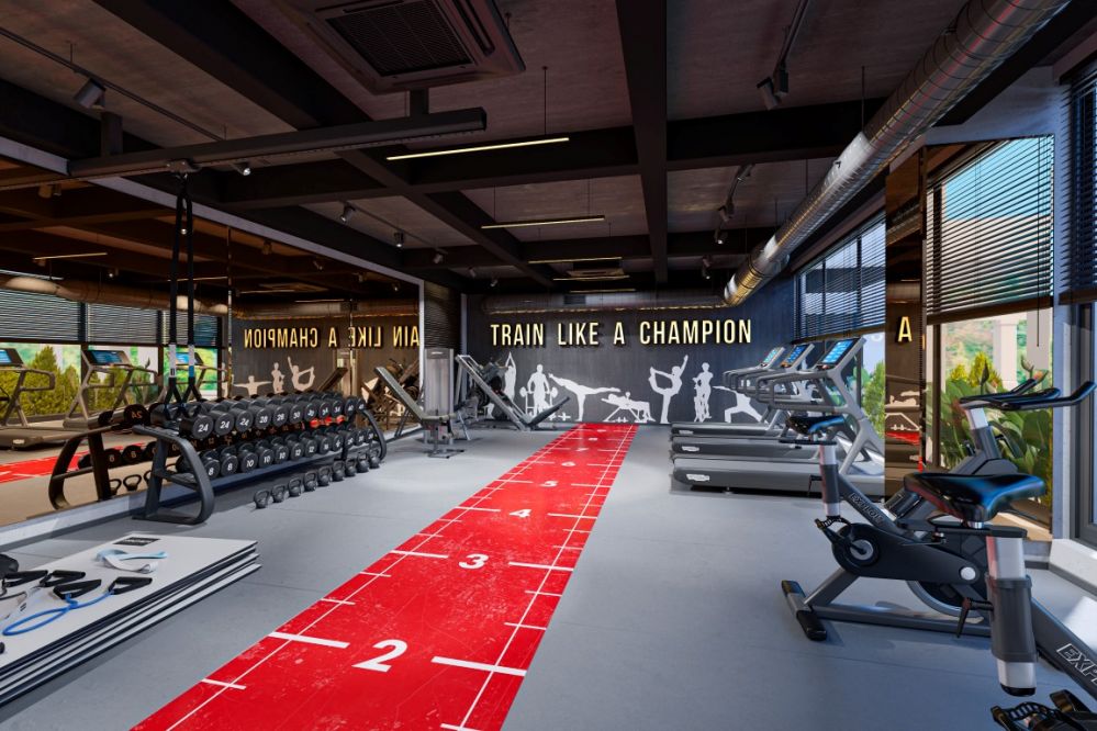 Profesyonel ekipmanlarla donatılmış modern fitness salonu.Kleopatra Plajı’na Yürüme Mesafesinde Modern Konut Projesi