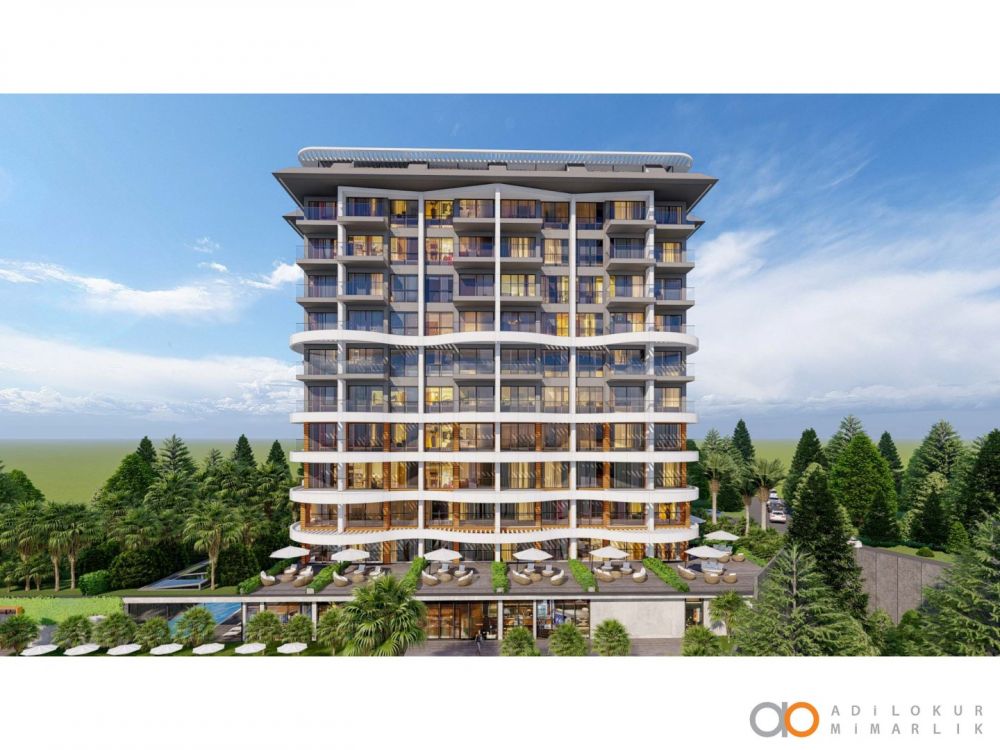 Семь этажей современного здания с просторными балконами и комфортной планировкой.Современный жилой комплекс с привлекательными инвестиционными возможностями в Демирташе, Аланья