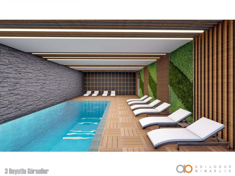 Зона отдыха с крытым бассейном, создающая уютную атмосферу релакса.Современный жилой комплекс с привлекательными инвестиционными возможностями в Демирташе, Аланья