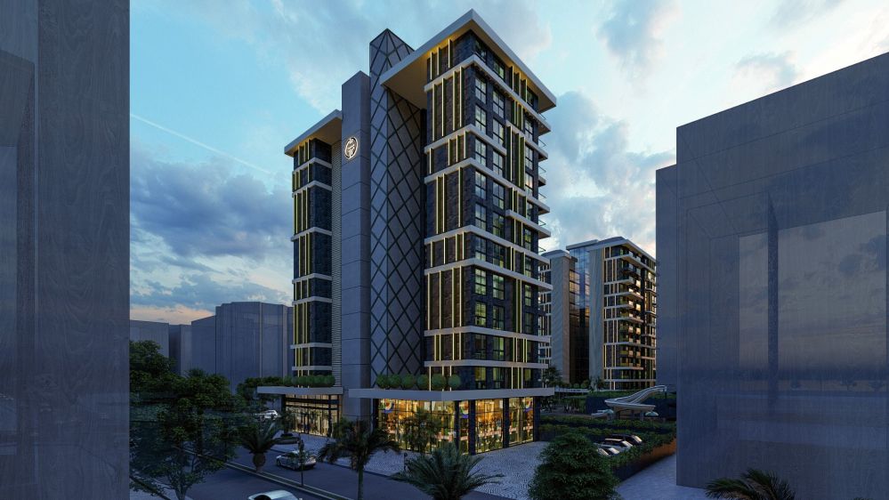 Seafront residence complex shining under Mahmutlar’s night lights.Seafront Luxury Apartments in Mahmutlar – New Investment Project in Alanya