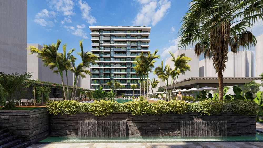 Luxury residence project featuring tropical gardens and modern greenery.Seafront Luxury Apartments in Mahmutlar – New Investment Project in Alanya