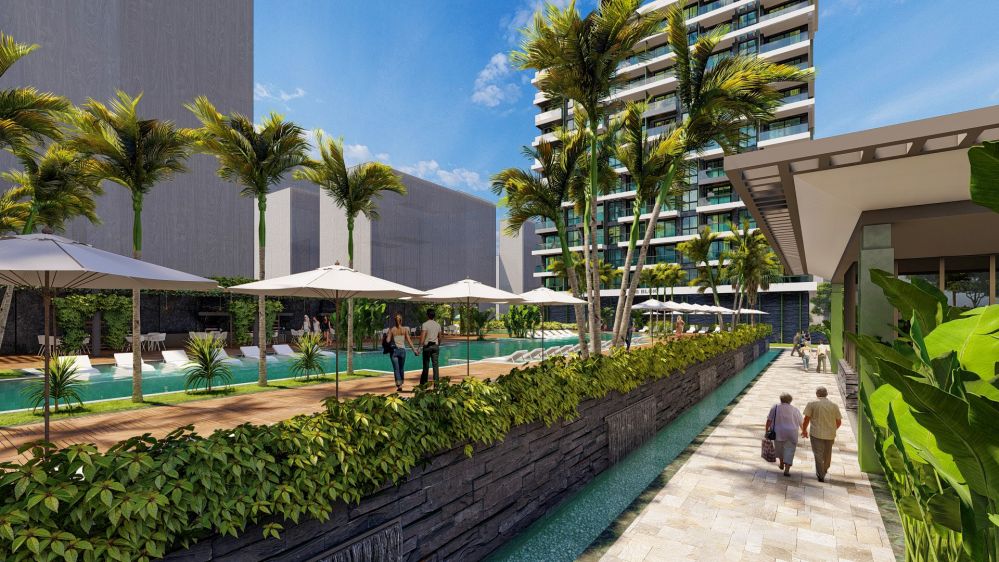 Seafront complex with large green areas and elegant exterior design.Seafront Luxury Apartments in Mahmutlar – New Investment Project in Alanya