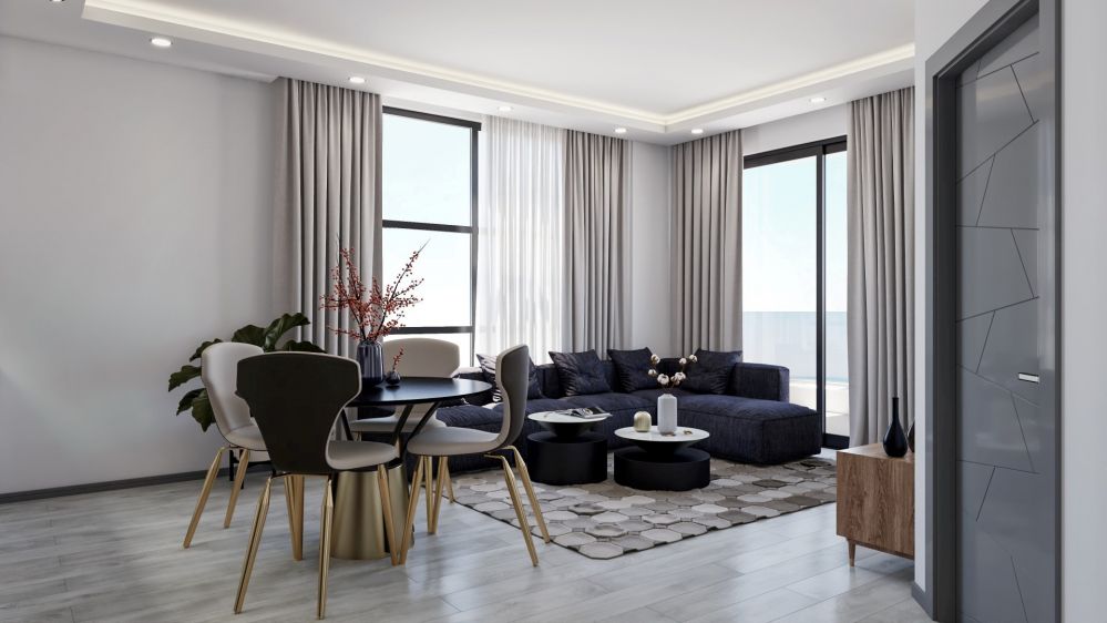 The living area features large panoramic windows and minimalist décor, creating a bright and airy home atmosphere.Modern Residential Project in Mahmutlar Alanya