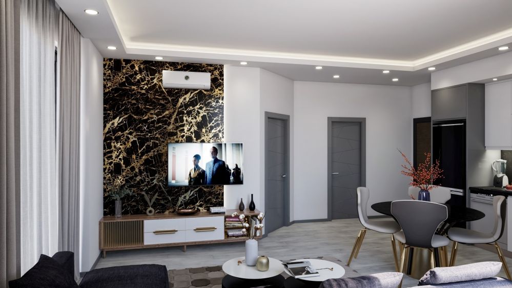 An open-plan living room with an integrated kitchen, creating a sense of space and modern functionality in daily life.Modern Residential Project in Mahmutlar Alanya