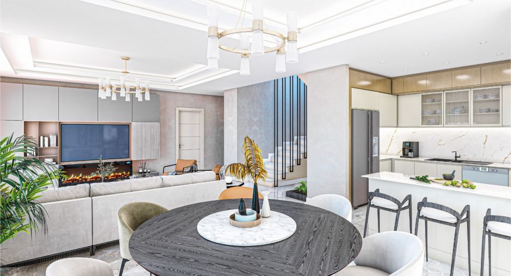 A stylish kitchen with sleek white cabinets and an island counter that blends beauty with practicality.Ultra Luxury Sea View Residential Project in Kargicak Alanya