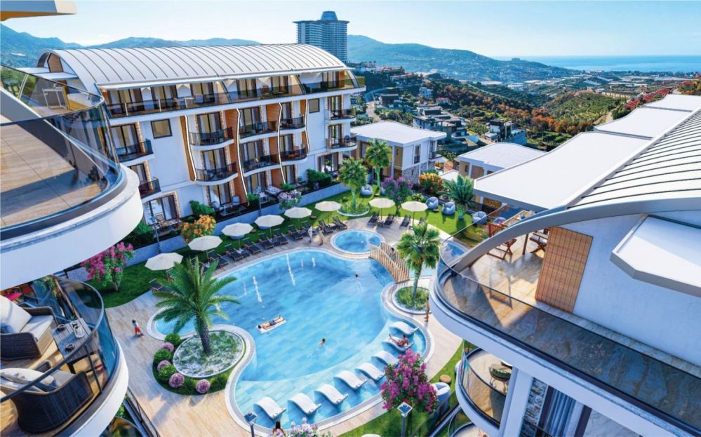 A large central pool surrounded by palm trees and sunbathing areas brings resort-style comfort right to your home.Ultra Luxury Sea View Residential Project in Kargicak Alanya
