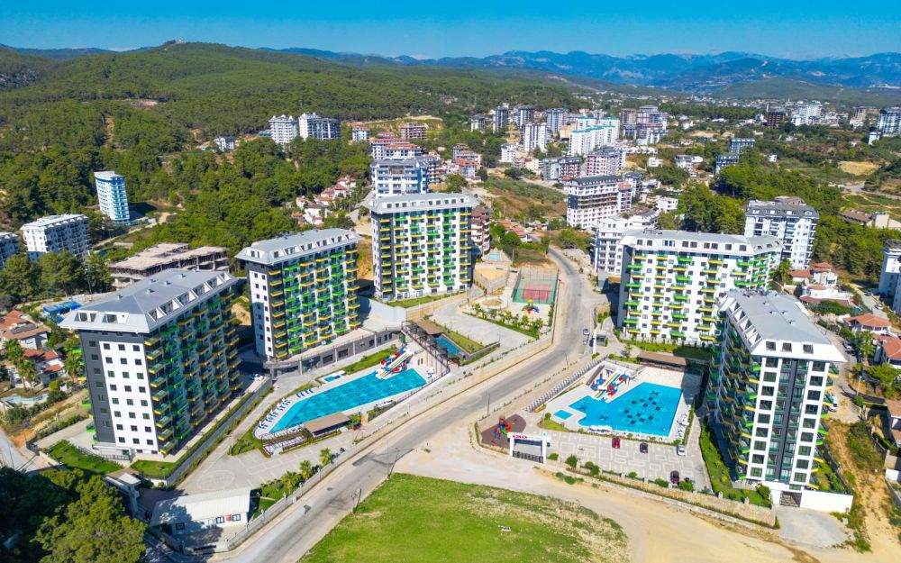 Просторный жилой проект с элегантной архитектурой и зелёными зонами рядом с морем. Роскошные и комфортные резиденции на побережье Средиземного моря