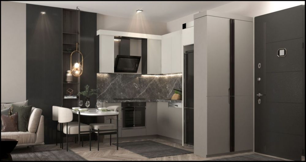 Современный интерьер, объединяющий кухню и гостиную с элегантными декоративными элементами.Современный жилой комплекс в Мерсине Тедже – квартиры 1+1 и 2+1