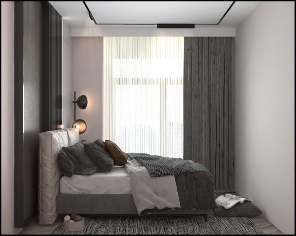 Современная спальня с элегантным освещением и большими окнами, наполняющими пространство светом.Современный жилой комплекс в Мерсине Тедже – квартиры 1+1 и 2+1